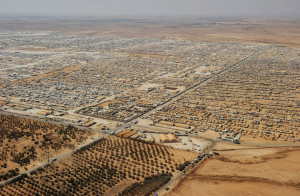 An aerial view shows the Zaatari refugee camp in Mafraq, Jordan, Thursday, July 18, 2013. Angry Syrian refugees urged U.S. Secretary of State John Kerry on Thursday to do more to help opponents of President Bashar Assad's government, venting frustration at perceived inaction on their behalf. (AP Photo/Mandel Ngan, Pool)